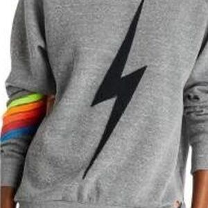 Gray Aviator Nation with Black Lightning Bolt, neon Rainbow Sleeve